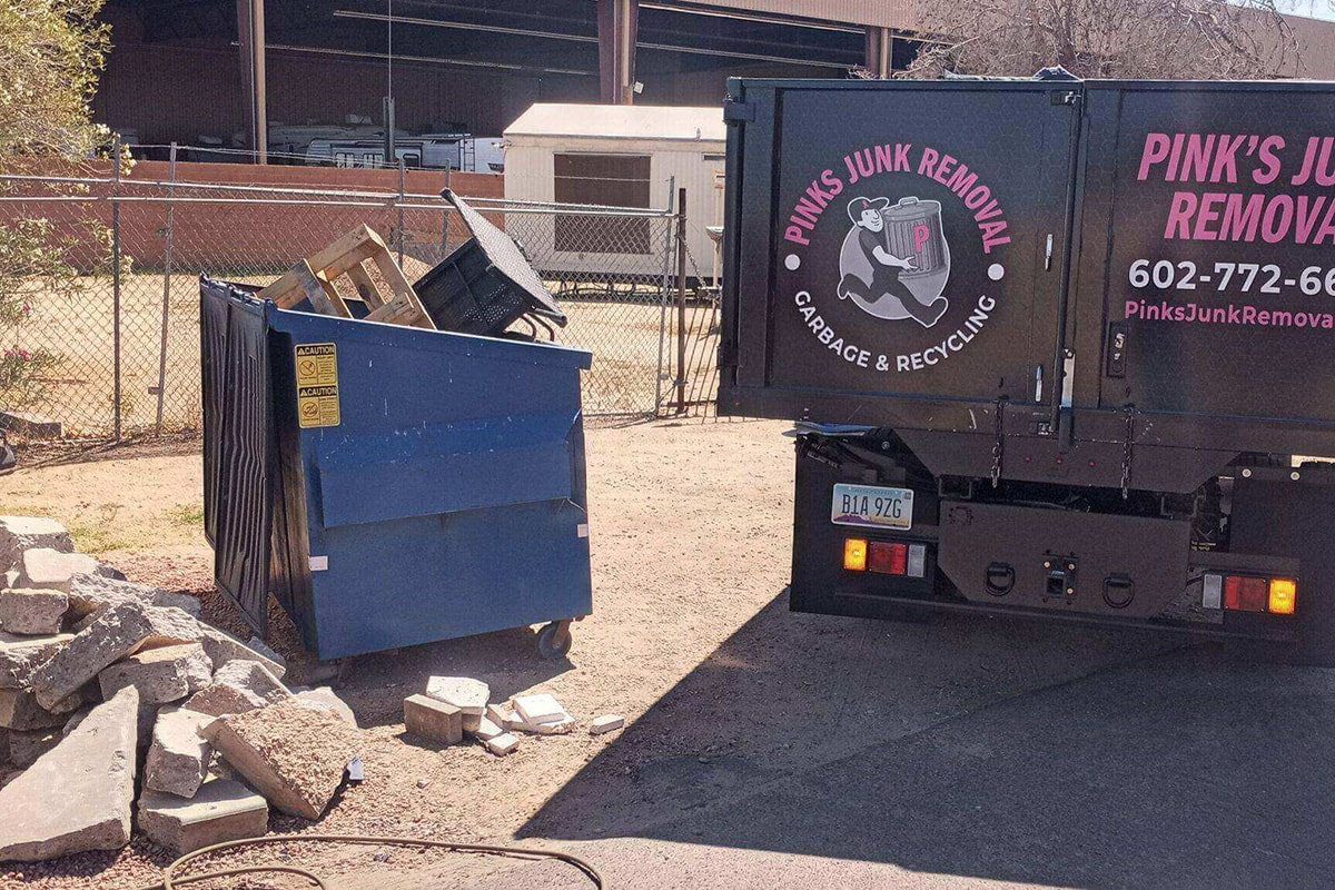 Construction debris and dumpster before haul-away