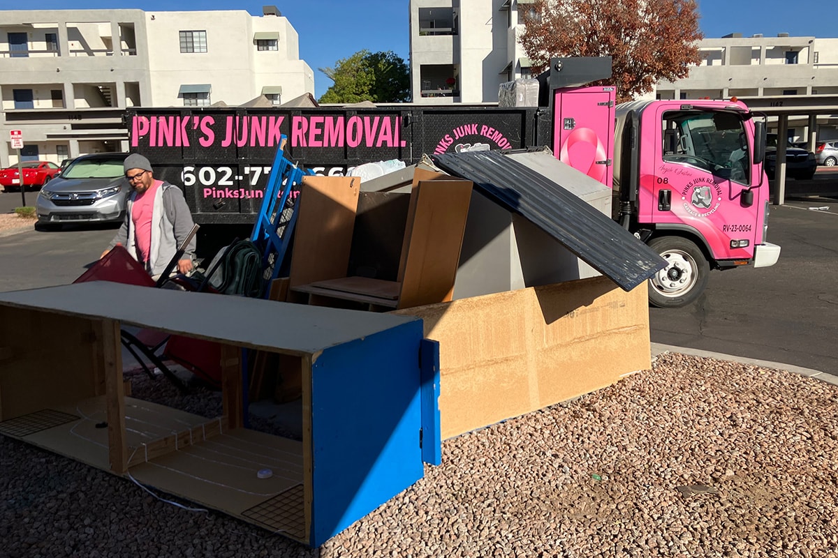 Commercial dumpster and debris before junk removal