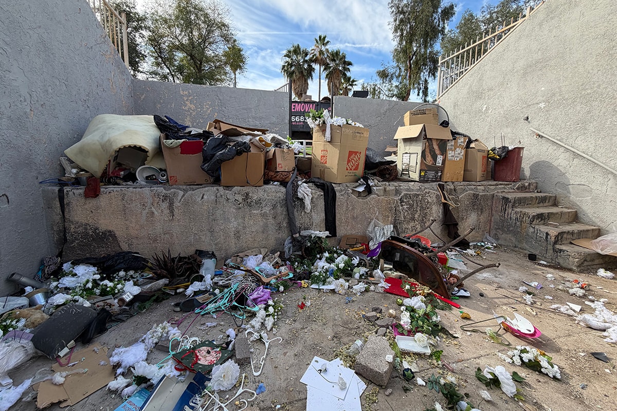 Debris-filled courtyard before cleanout