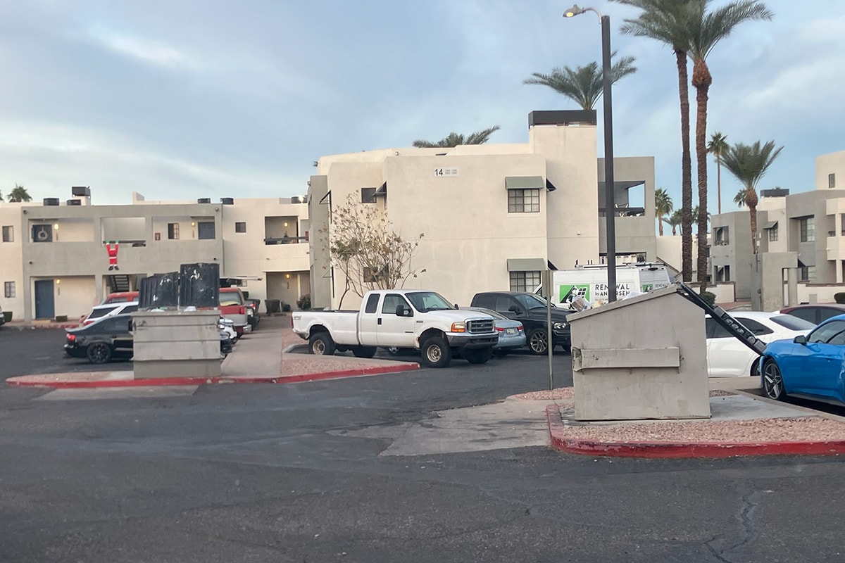Clean apartment parking lot after junk removal