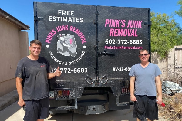 Pinks crew with happy customer after junk removal