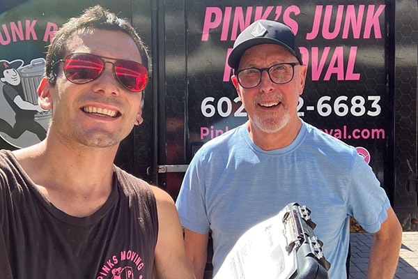 Pinks crew with happy customer after junk removal