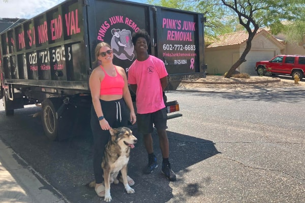 Pinks crew with happy customer after junk removal