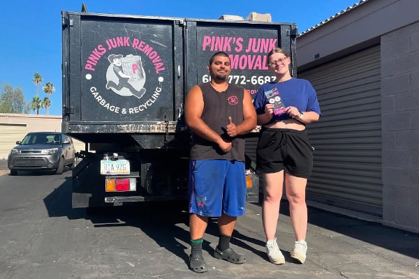Pinks crew with happy customer after junk removal