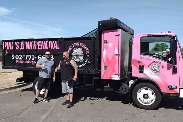 Pinks crew with happy customer after junk removal