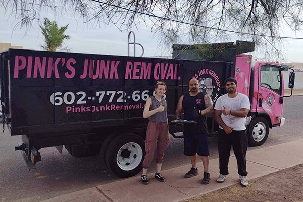 Pinks crew with happy customer after junk removal